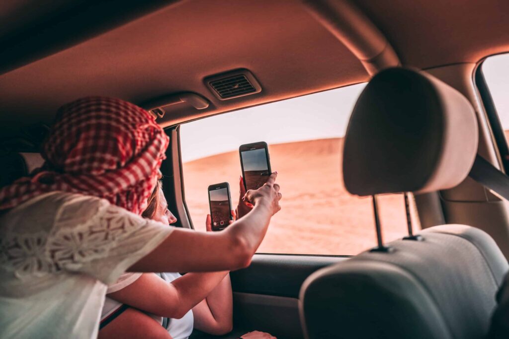 people-taking-photo-of-the-desert